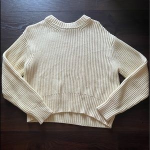 This is a yellow sweater good for spring, winter, and fall.